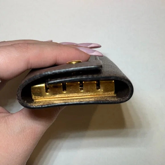 Hermès Black Leather Key Holder with Gold Accents - Picture 9 of 10